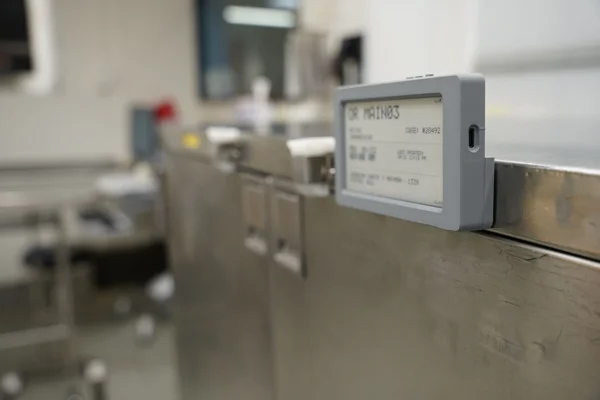 JUNO e-paper device on surgical cart showing automated digital workflow